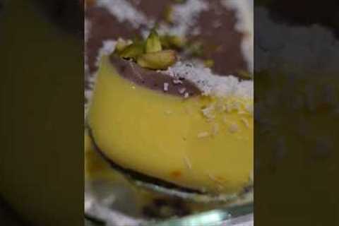 saffron pudding with chocolate pistachio coconut topping