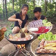 Squid spices chili cooking with mushroom for food in jungle, Survival cooking